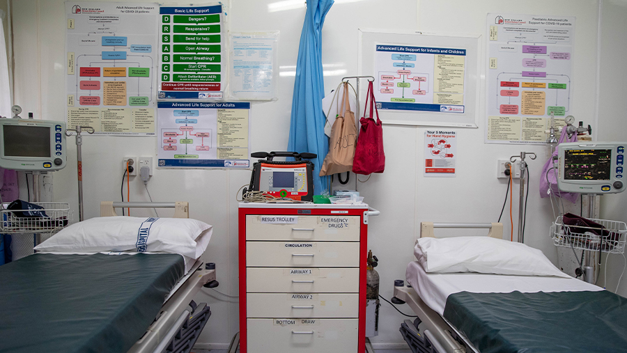 a staff wearing a facemask in the vaccination jab area