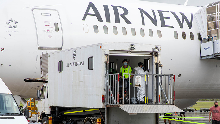 a staff moving Pfizer vaccination to the flight