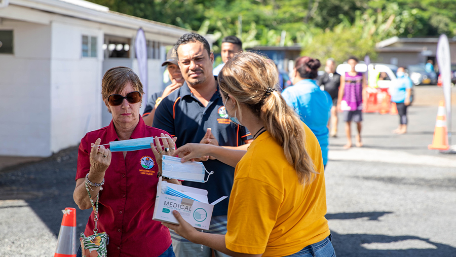 a staff wearing a facemask in the vaccination jab area