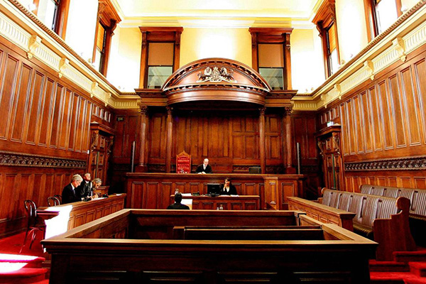 Inside a wood panelled courtroom